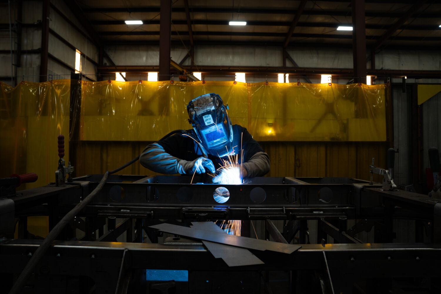 A welder is seen inside the Allen Engineering Corporation plant Monday, March 16, 2026, in Paragoul...
