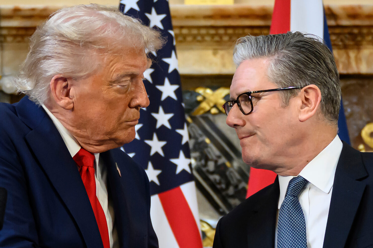 U.S. President Donald Trump, left, and British Prime Minister Keir Starmer look at each other as th...