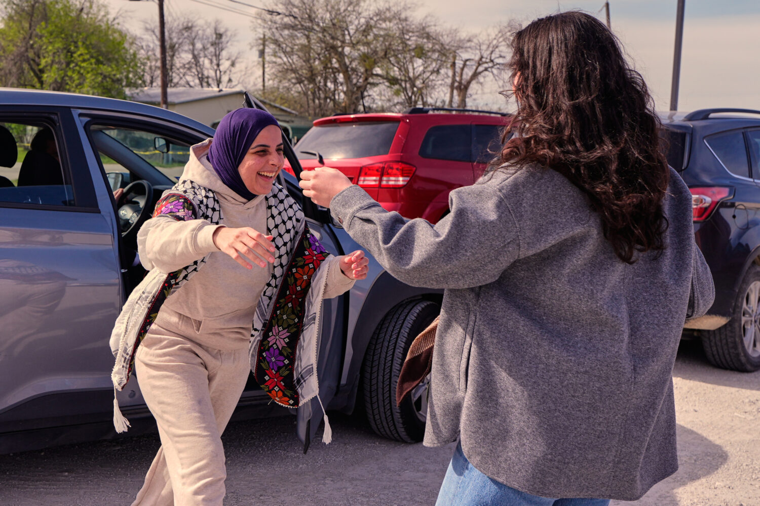 Leqaa Kordia, left, moves to embrace friends, family and suppporters after being released from the ...