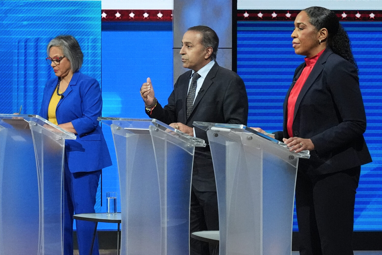 U.S. Rep. Raja Krishnamoorthi (D-Ill.), center, speaks as U.S. Rep. Robin Kelly (D-Ill.), left, and...