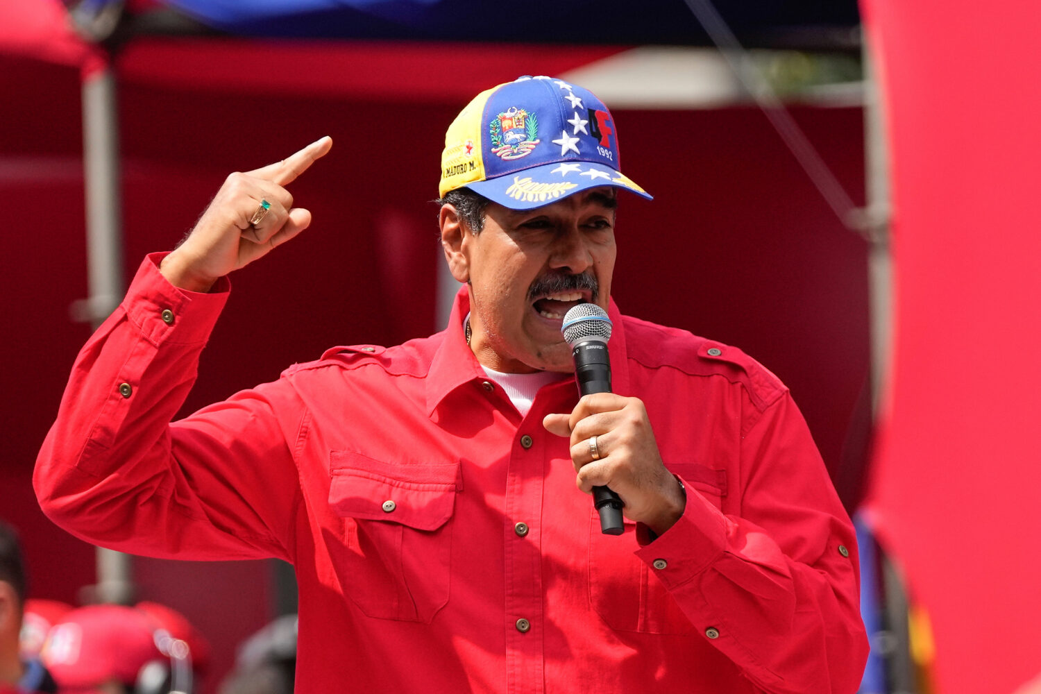 File - Venezuela's President Nicolas Maduro speaks to supporters during an event at the Miraflores ...