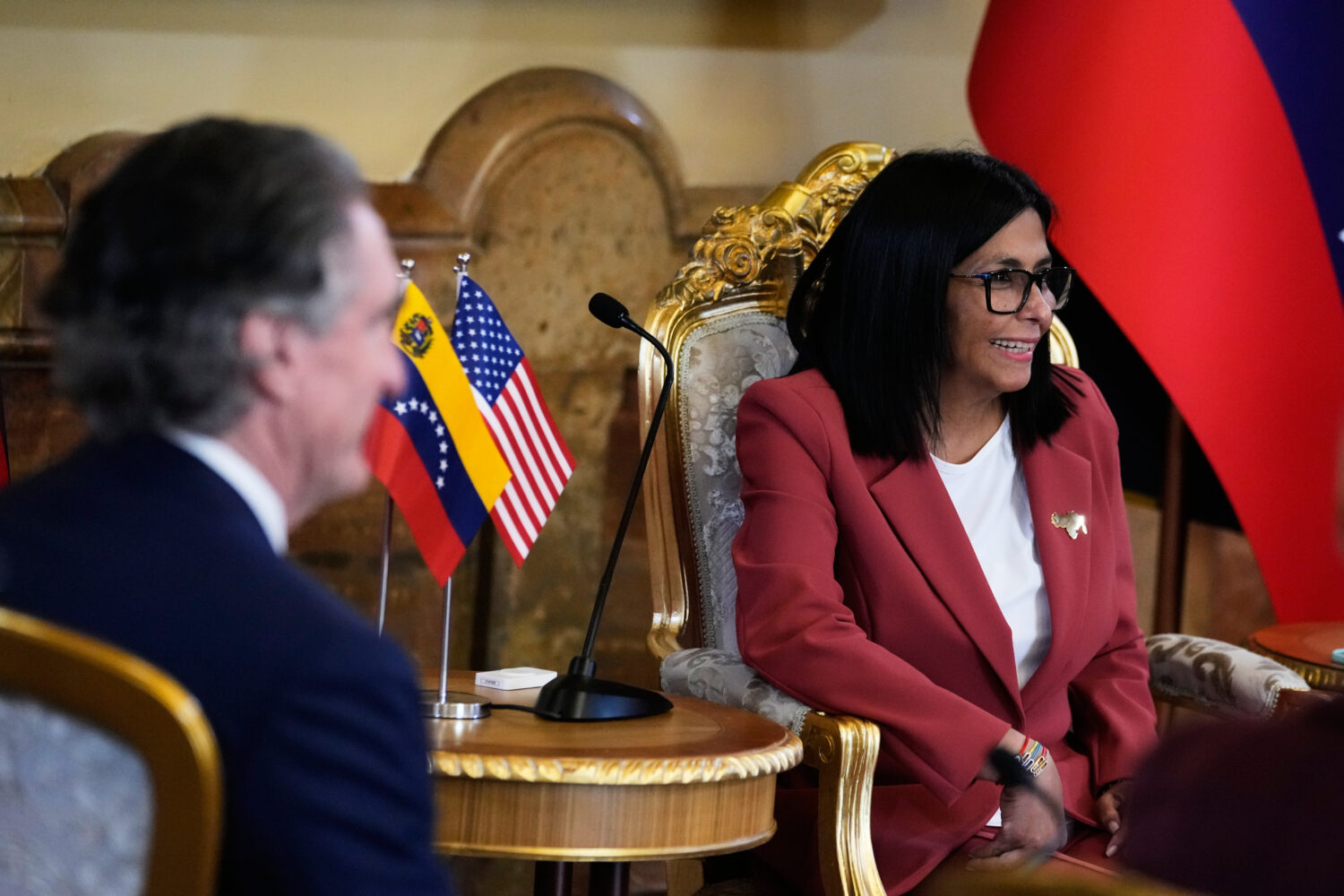 Venezuela's acting President Delcy Rodriguez, right, and U.S. Interior Secretary Doug Burgum meet a...