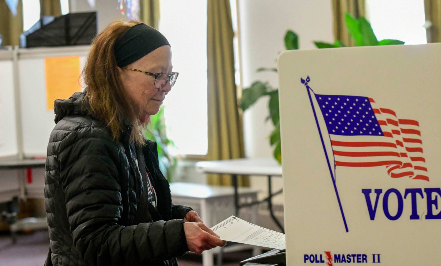 Kathleen Nutter of Wilmington, Vt., casts her ballot at the polling station in Wilmington, during T...