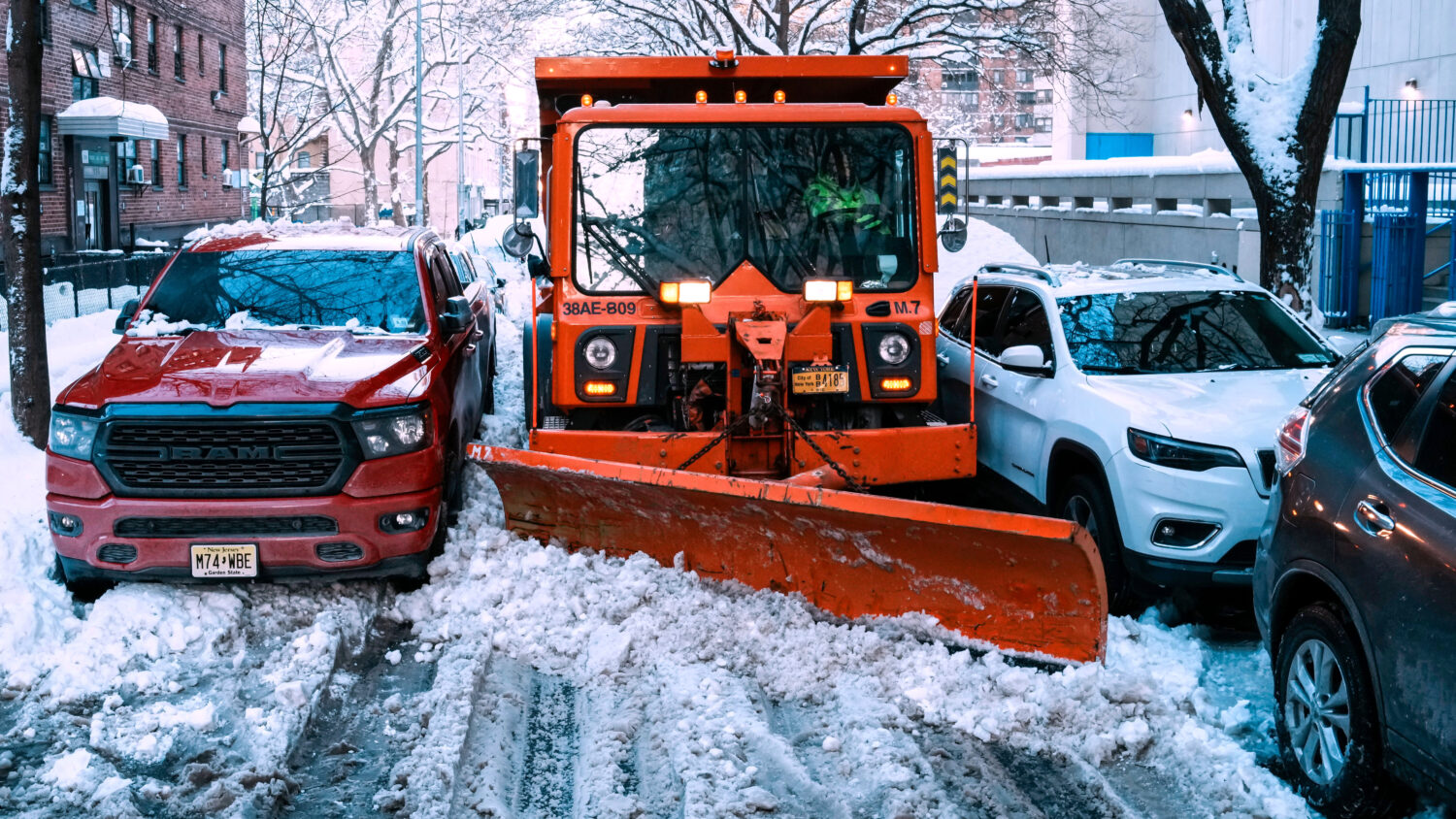 A truck removes snow for them street a day after a winter storm on Tuesday, Feb. 24, 2026, in New Y...