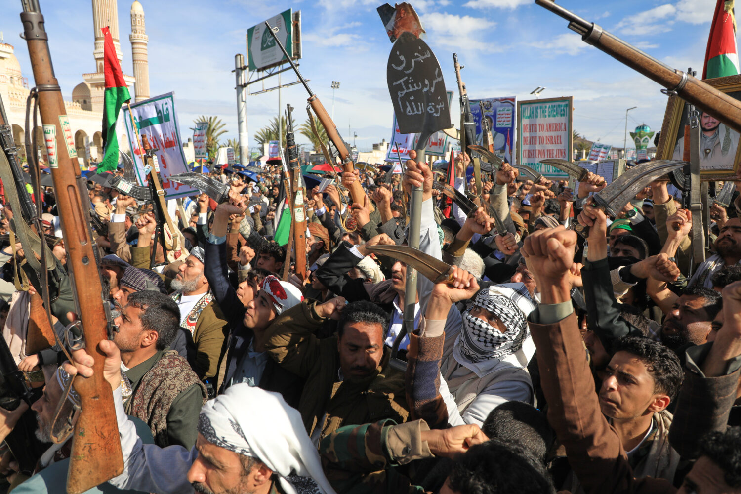 Houthi supporters shout slogans during a rally against Israel and the United States' war in Iran, i...