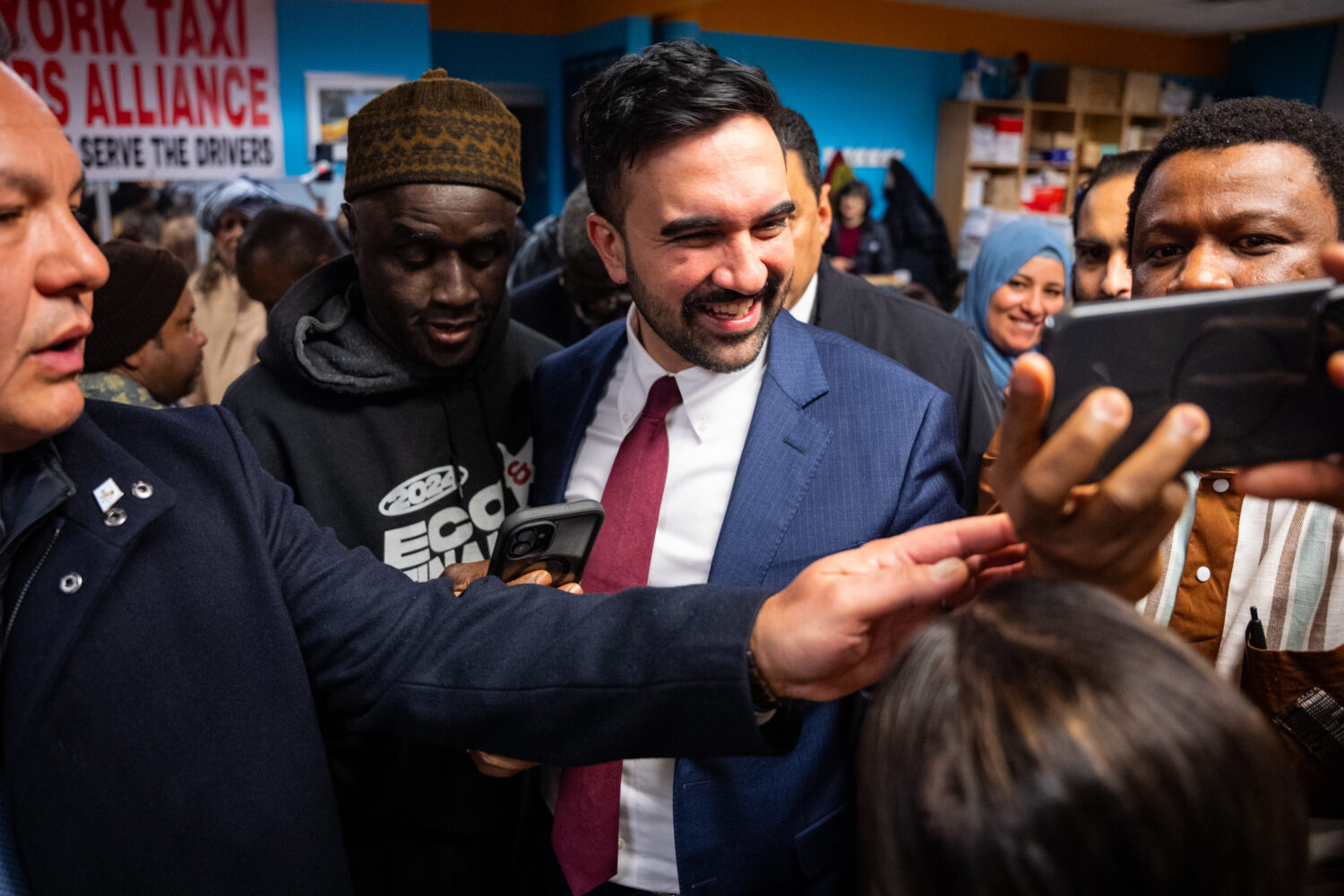 People greet and take photos with New York City Mayor Zohran Mamdani at a Ramadan Iftar hosted by h...