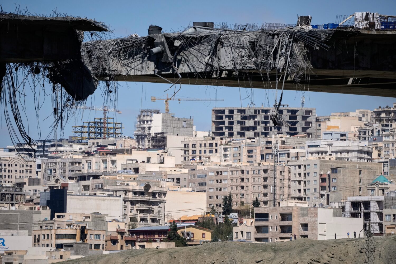 A bridge struck by U.S. airstrikes on Thursday is seen in the town of Karaj, west of Tehran, Iran, ...