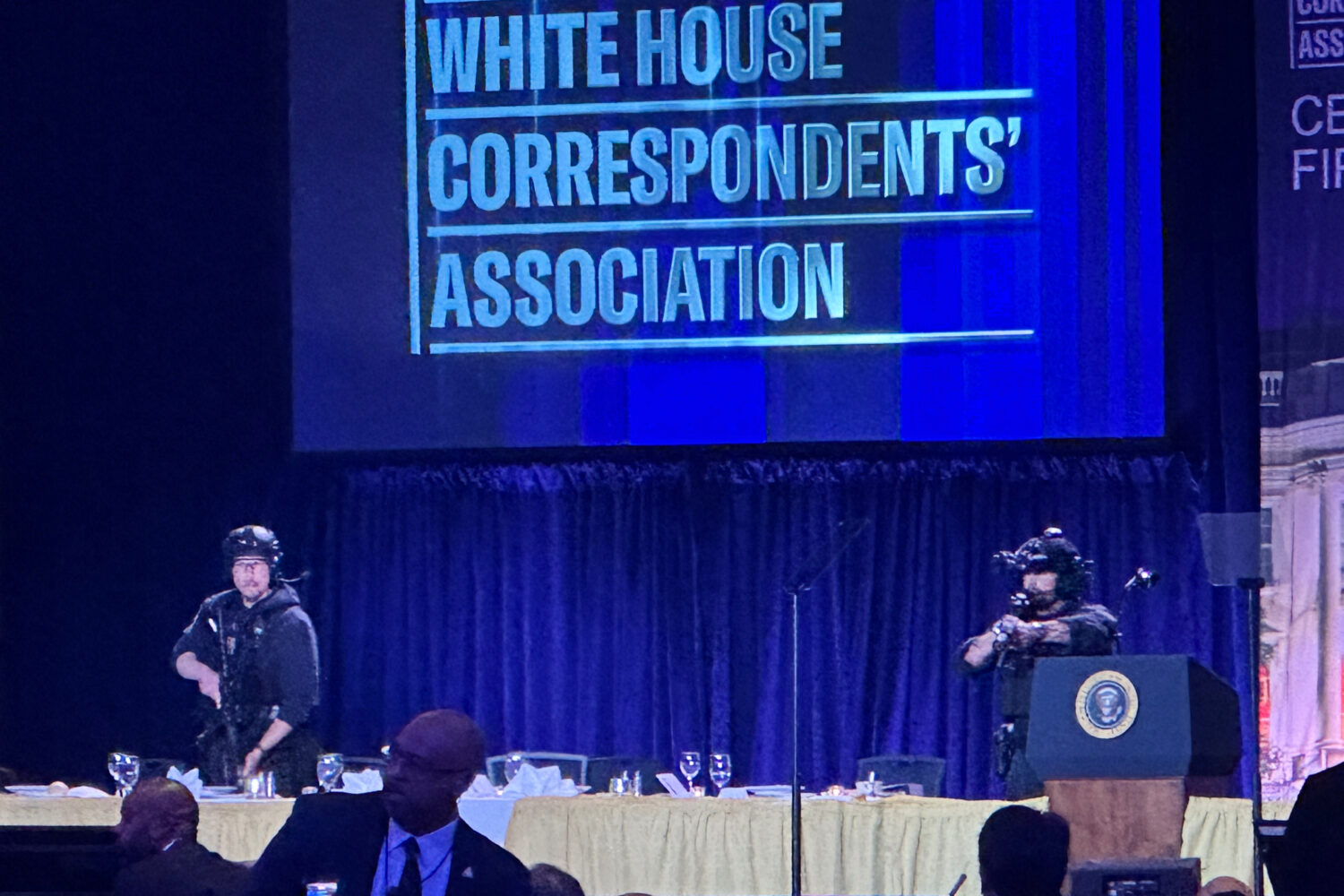 U.S. Secret Service agents respond on stage during the White House Correspondents Dinner, Saturday,...