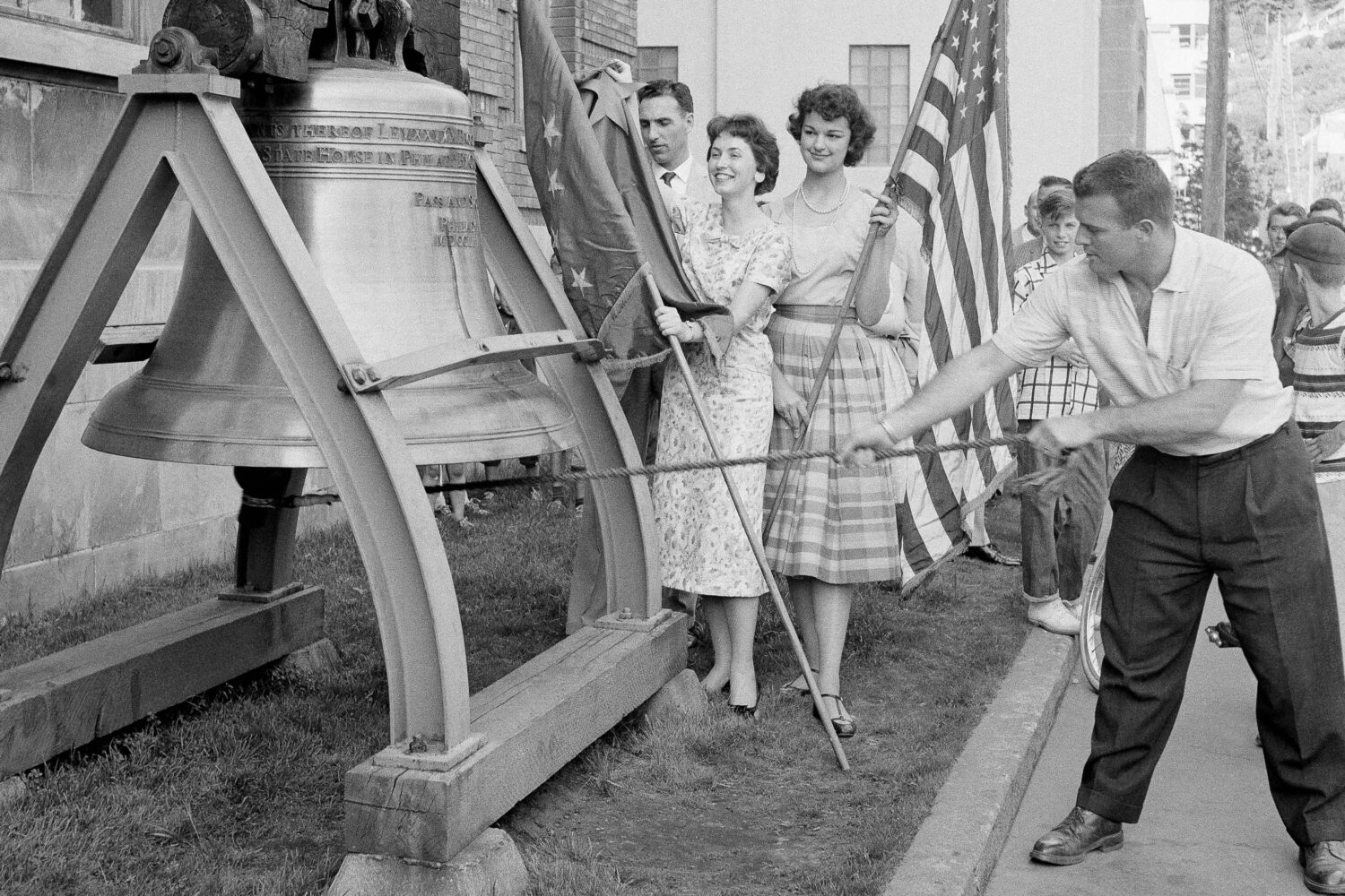 FILE - Romer Derr rings a replica of the Liberty Bell outside the Federal Building 49 times, signif...