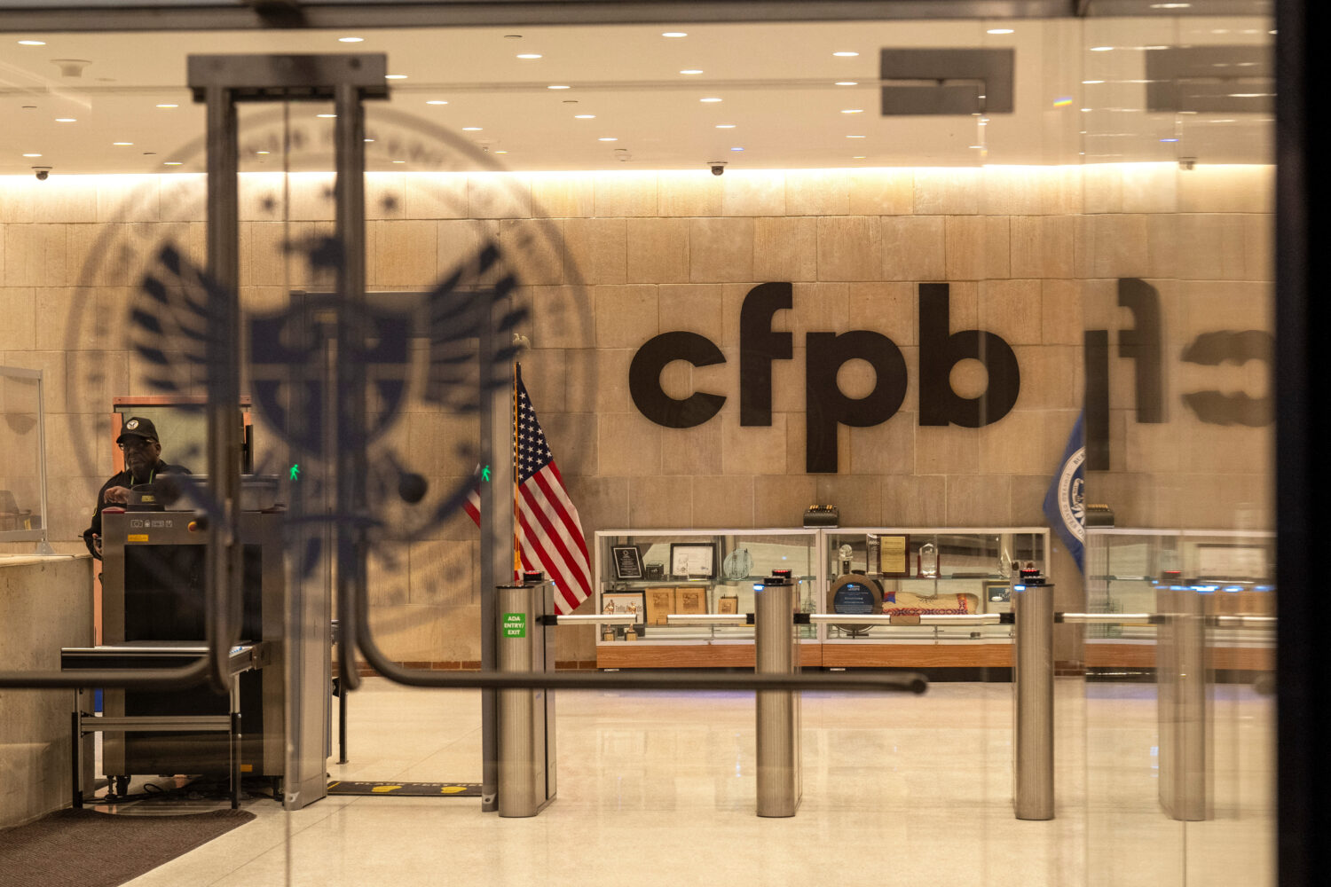 FILE - A security officer works inside of the Consumer Financial Protection Bureau (CFPB) building ...