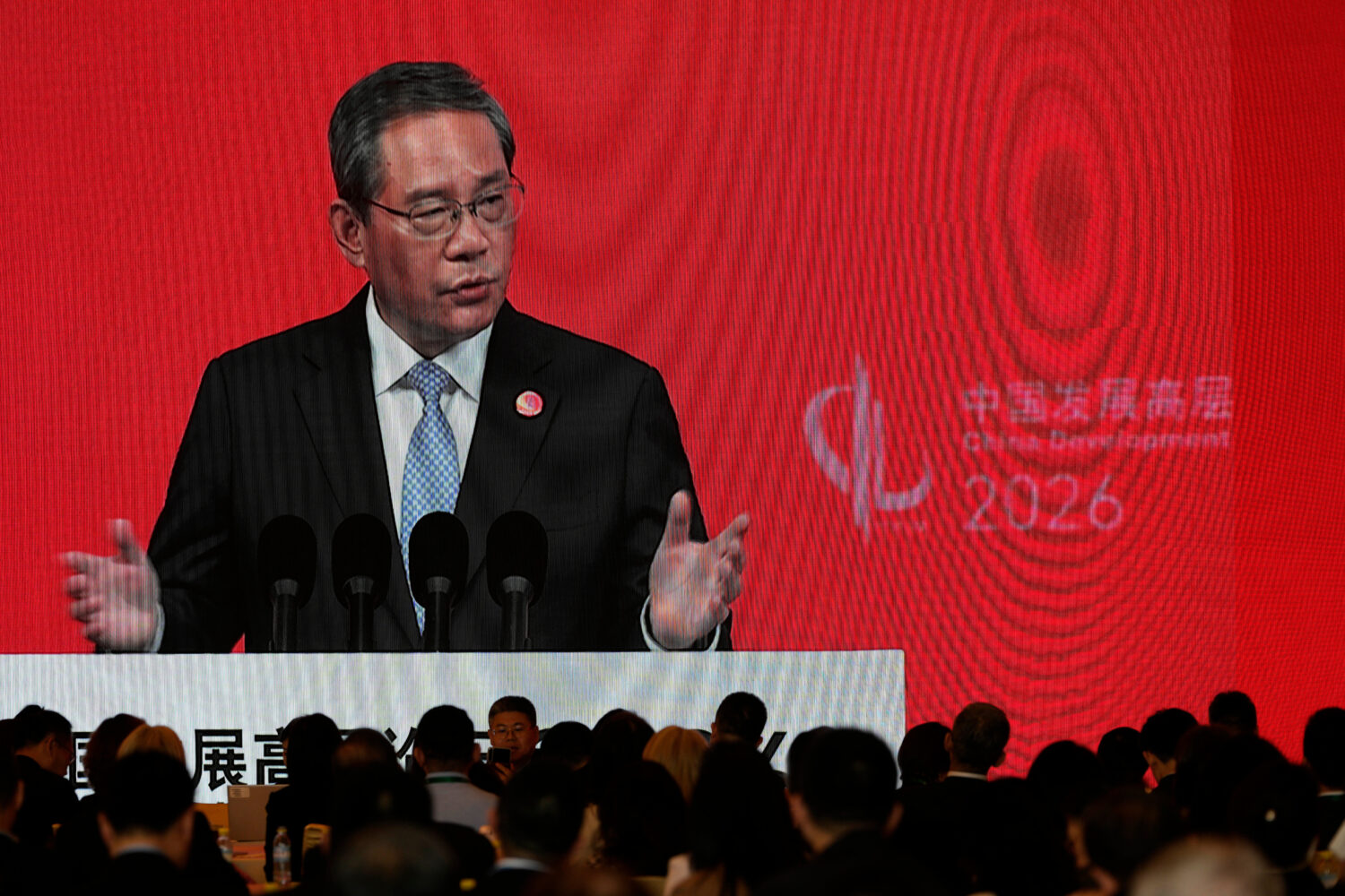 Chinese Premier Li Qiang is displayed on a large screen live broadcasting his speech at the opening...
