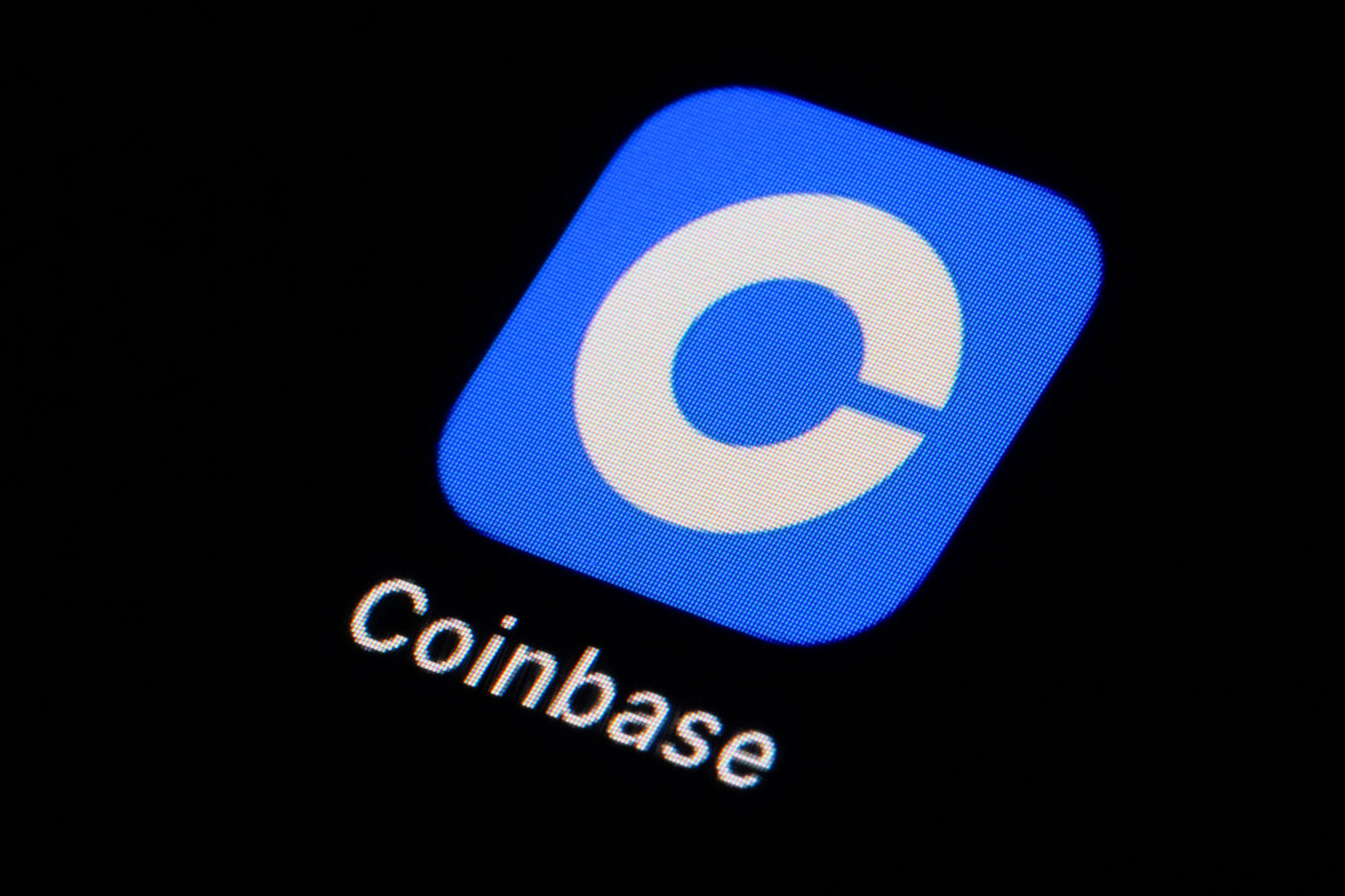 FILE - The Coinbase app icon is seen on a smartphone, Feb. 28, 2023, in Marple Township, Pa. (AP Ph...