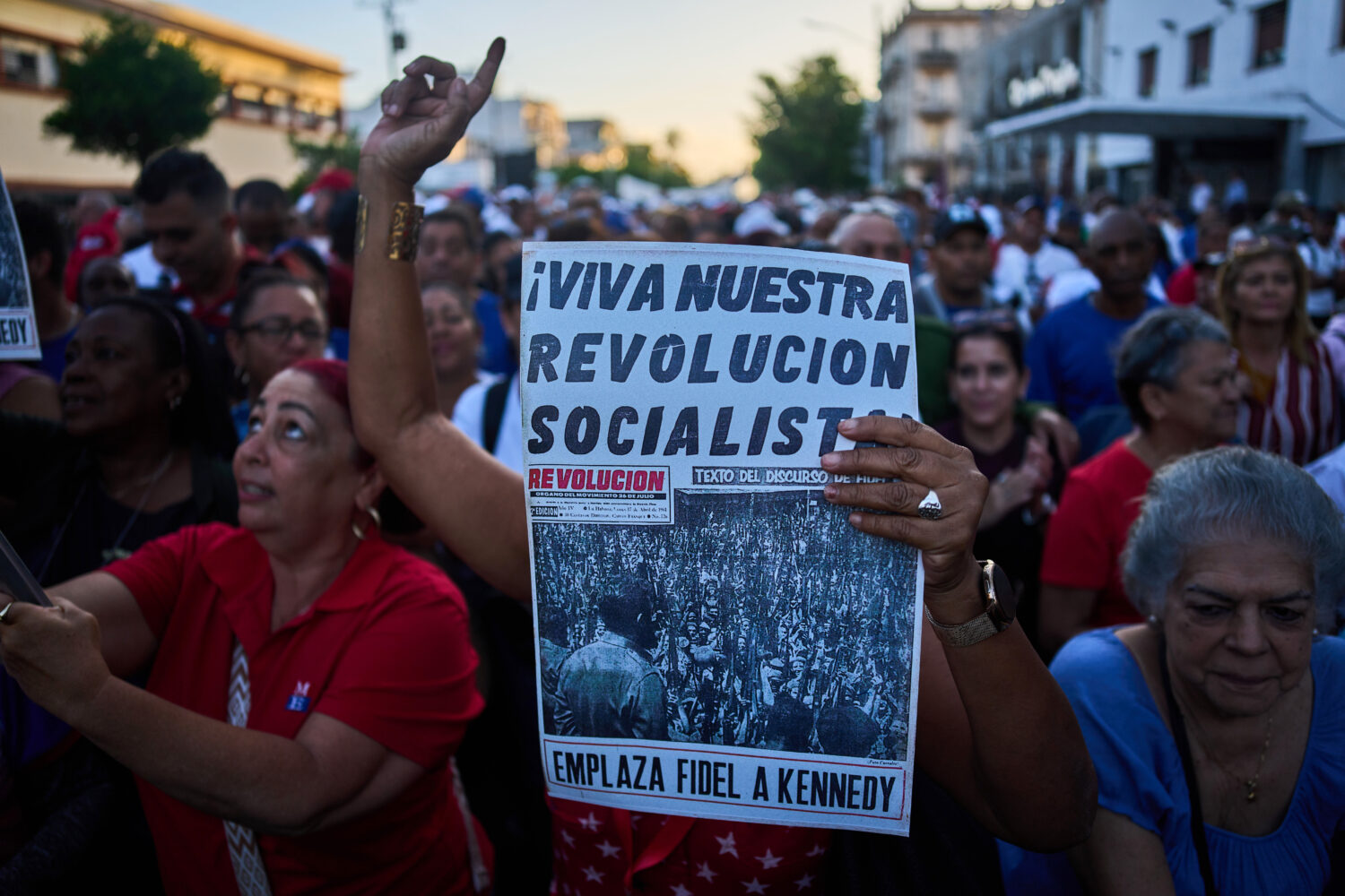 People attend a celebration marking the 65th anniversary of the proclamation declaring the Cuban Re...