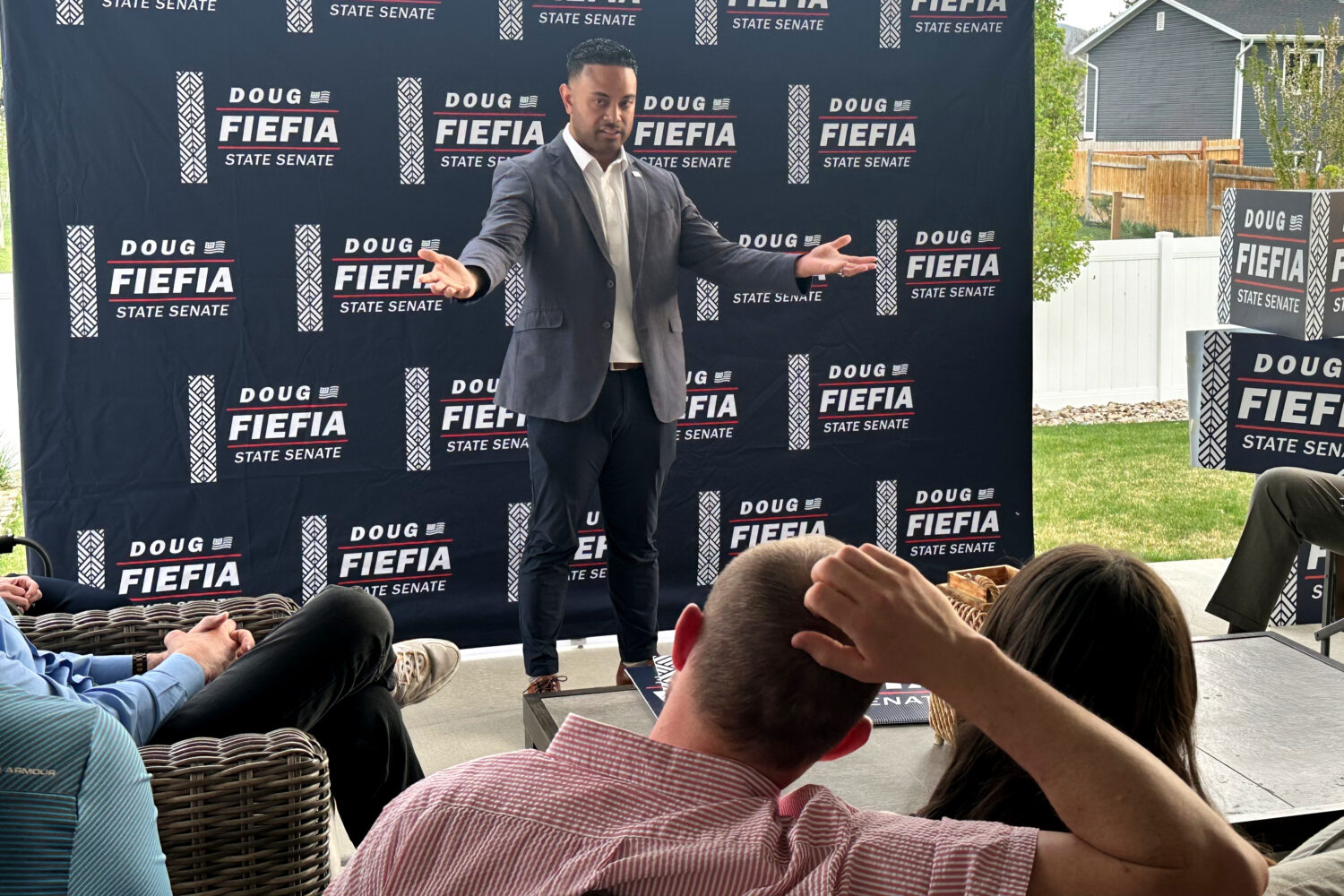 Utah State Rep. Doug Fiefia talks to Utah voters on the back deck of a house, Thursday, April 9, 20...