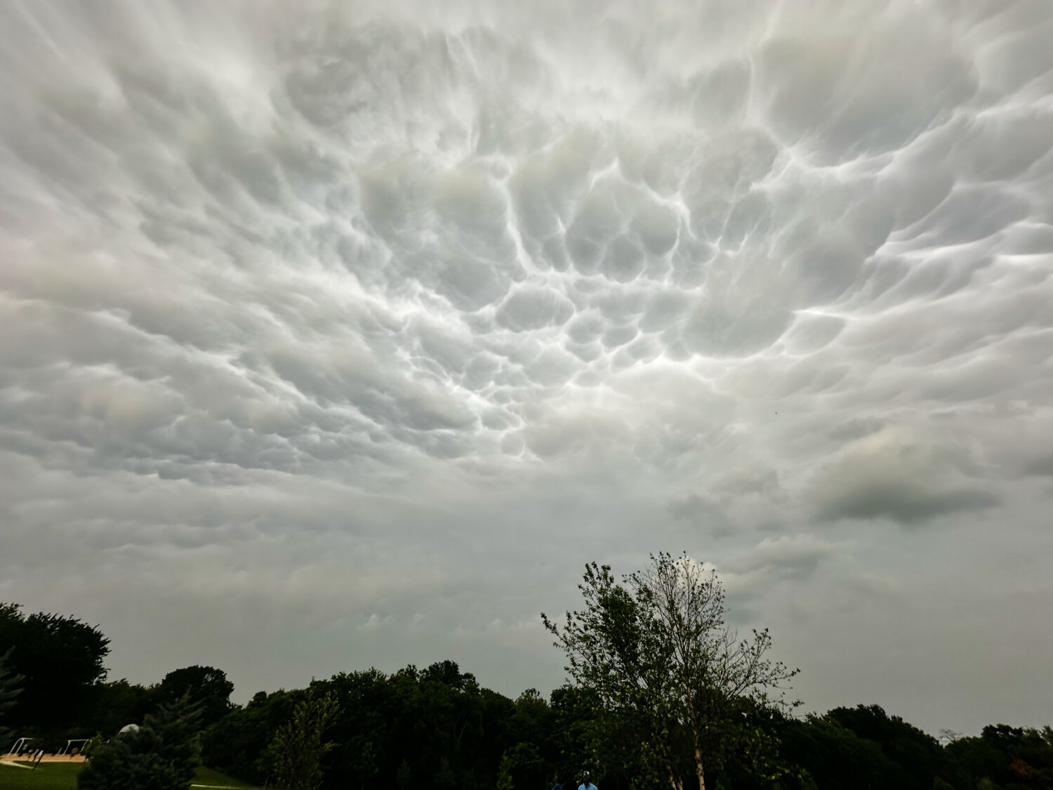 Storm clouds form over a public park as thunderstorms approaches the region, Saturday, April 25, 20...