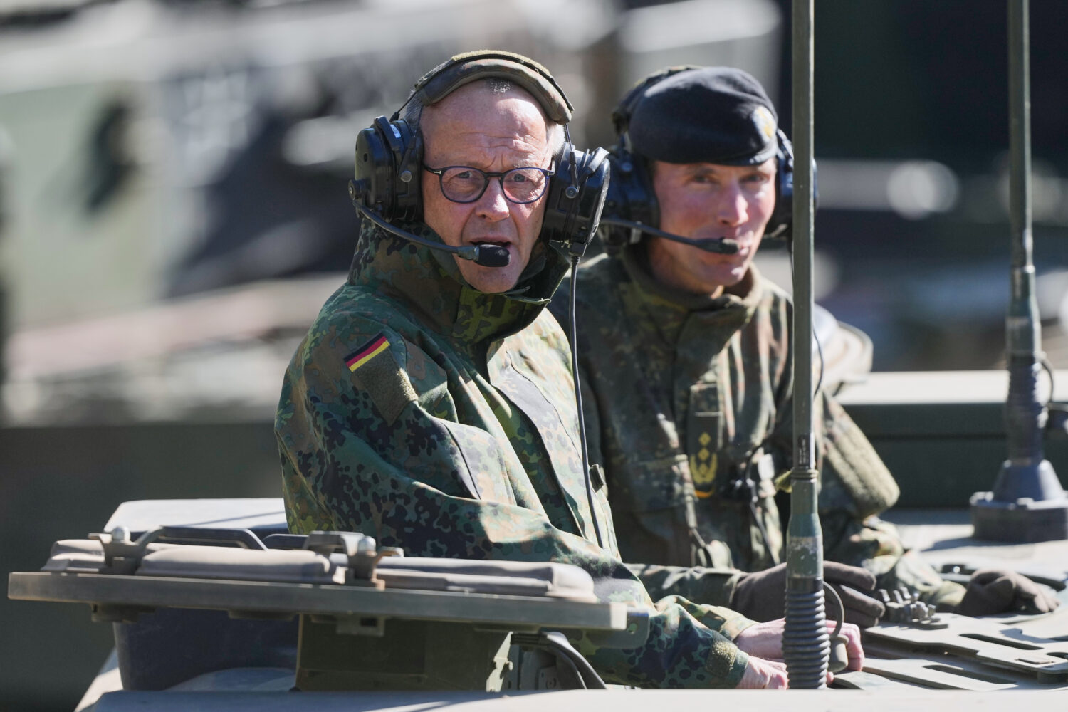 German Chancellor Friedrich Merz drives in the armoured fighting vehicle Boxer during his visit to ...