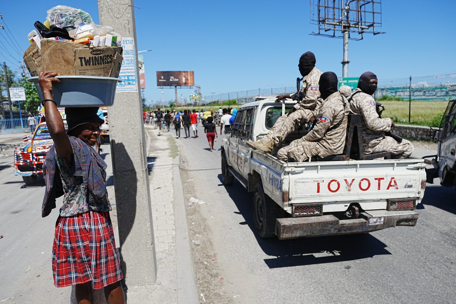 National Police patrol as factory workers march demanding a salary increase in Port-au-Prince, Hait...