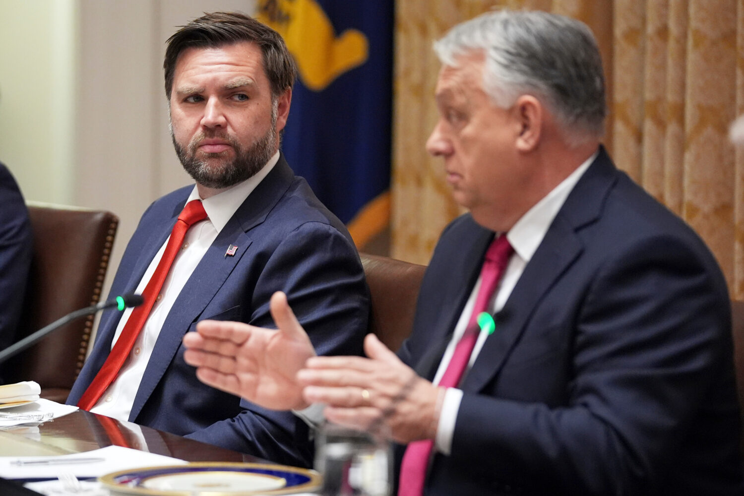 FILE - Vice President JD Vance, left, listens as Hungary's Prime Minister Viktor Orban speaks durin...