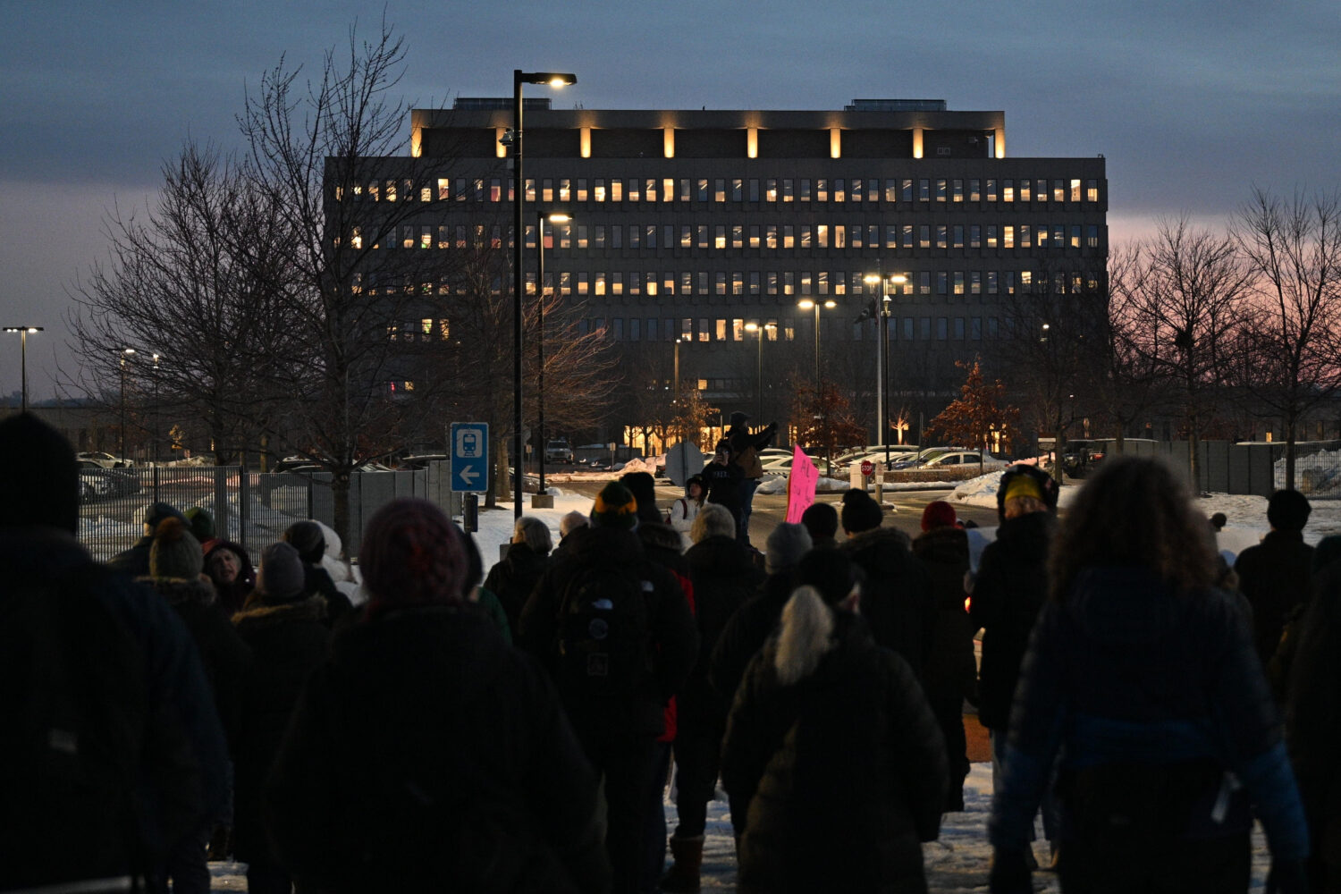 FILE - Protesters gather outside the Bishop Henry Whipple Federal Building, Jan. 8, 2026, in Minnea...