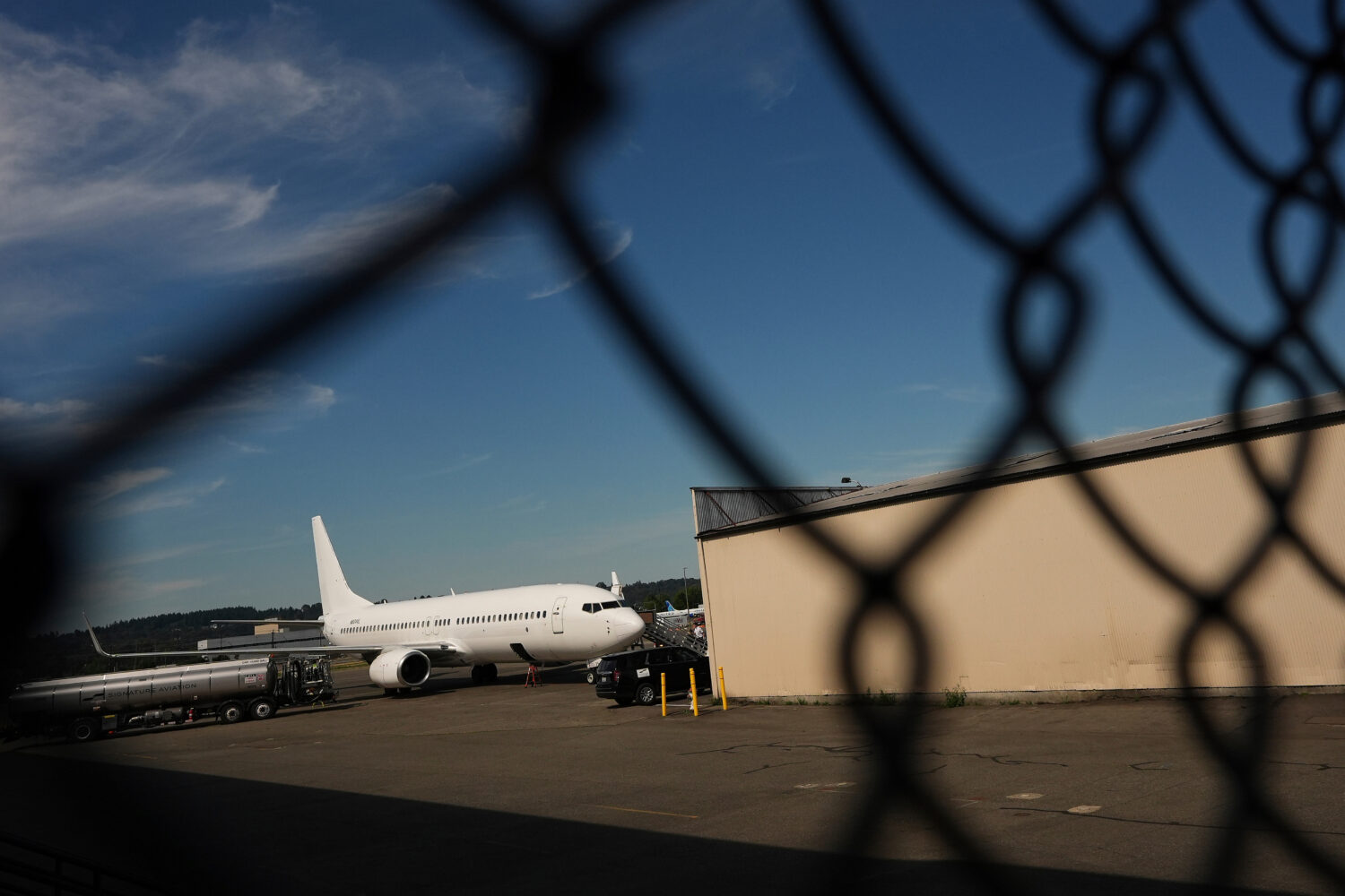FILE - A U.S. Immigration and Customs Enforcement flight operates out of King County International ...