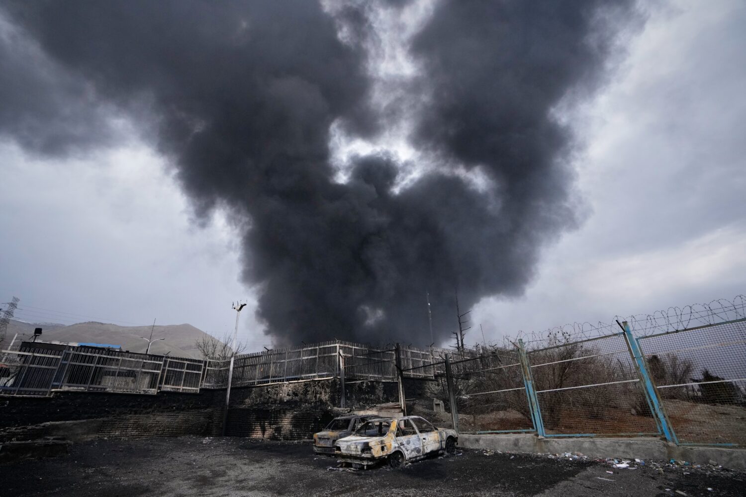 FILE - A thick plume of smoke rises from an oil storage facility hit by a U.S.-Israeli strike in Te...