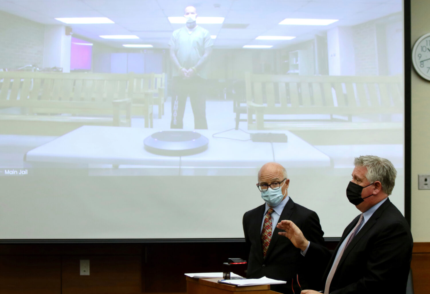FILE - Defense attorney Mark Collins, right, speaks to the judge as defense attorney Steve Nodler, ...