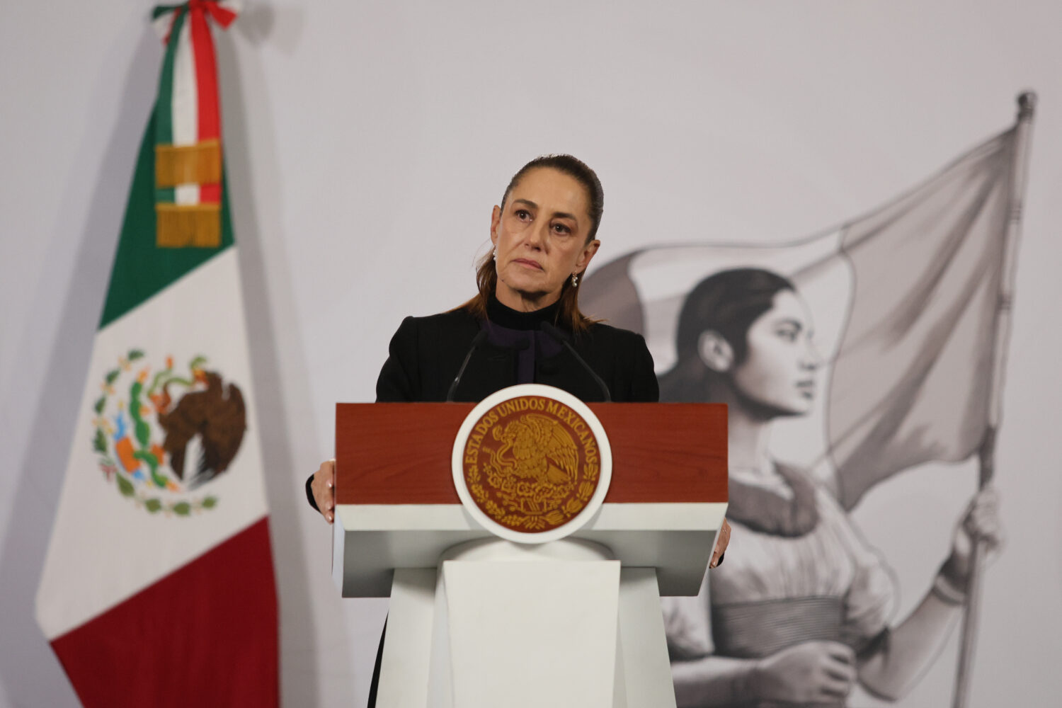 FILE - Mexican President Claudia Sheinbaum gives her the daily, morning news conference at the Nati...