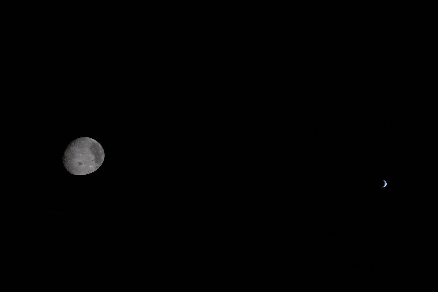 This image provided by NASA, the Artemis II crew captured this view the Moon and Earth are shown on...