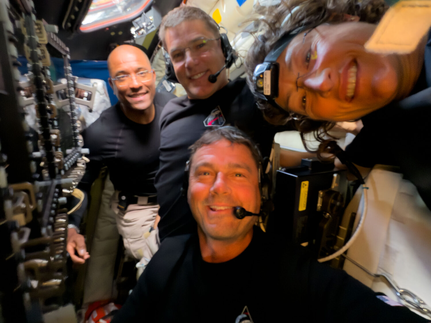 In this image provided by NASA, Artemis II crew members, from left, Victor Glover Jeremy Hansen, Vi...