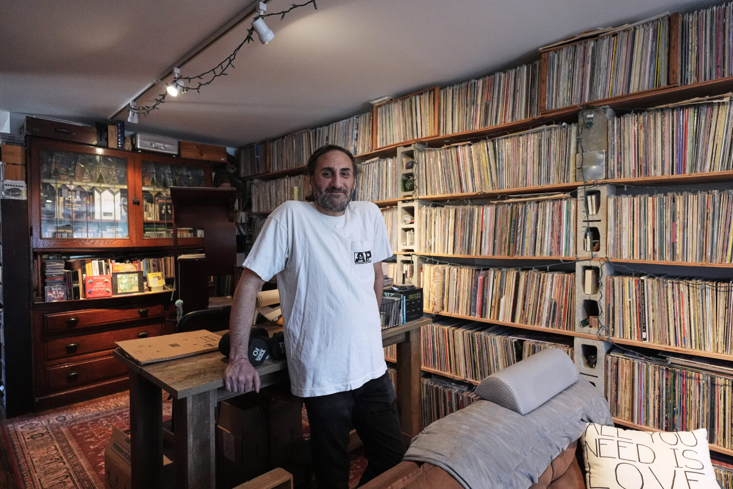 Aadam Jacobs poses in front of LP (long play) record storage bookcase at his home in Chicago, Thurs...