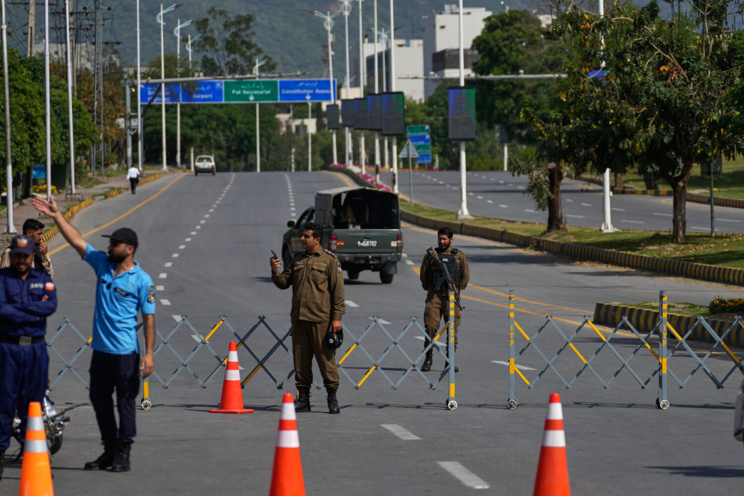 Police officers stand guard at a checkpoint ahead of the second round of negotiations between the U...