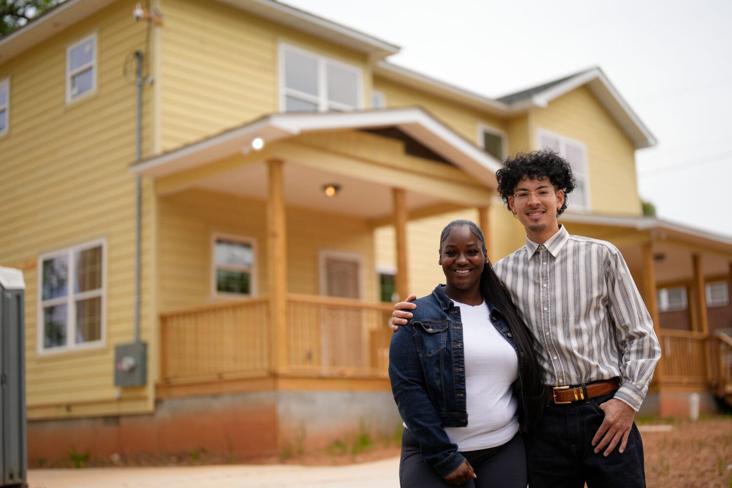 Home owners Phileena Daniel and Oswaldo Herrera pose for a photo in Langston Park, April 13, 2026, ...