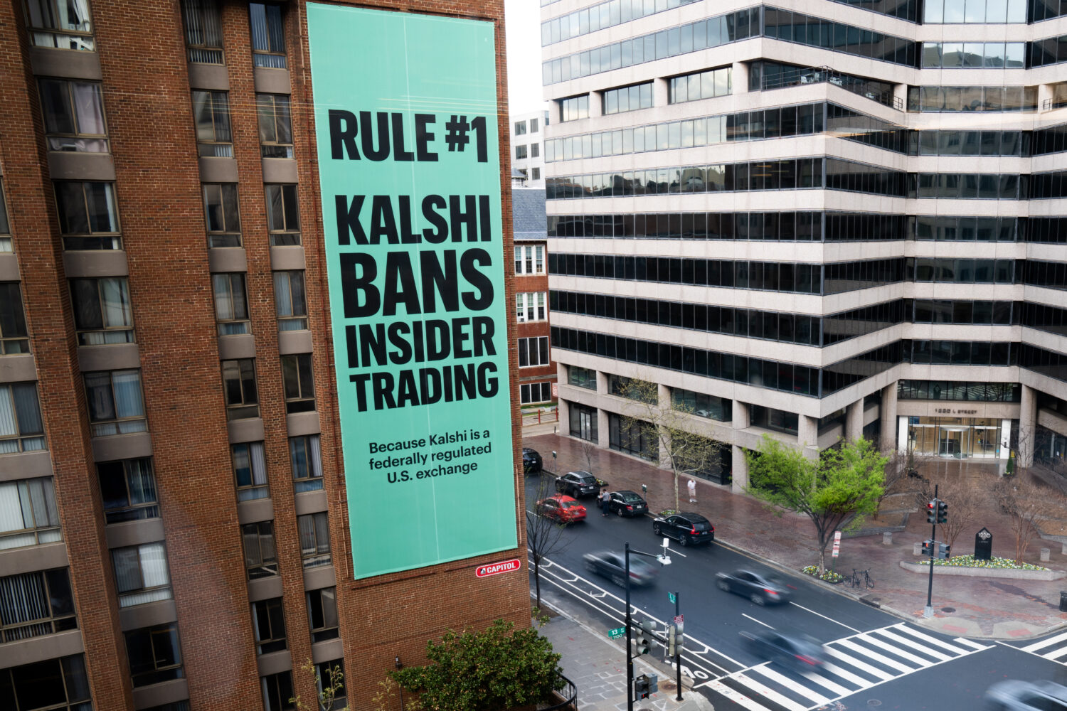 FILE - An advertisement for prediction market platform Kalshi hangs at 13th and L Streets in northw...