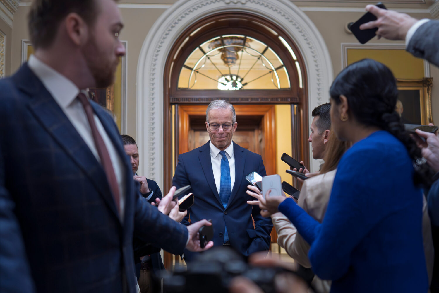 Senate Majority Leader John Thune, R-S.D., speaks to reporters outside the chamber at the Capitol i...