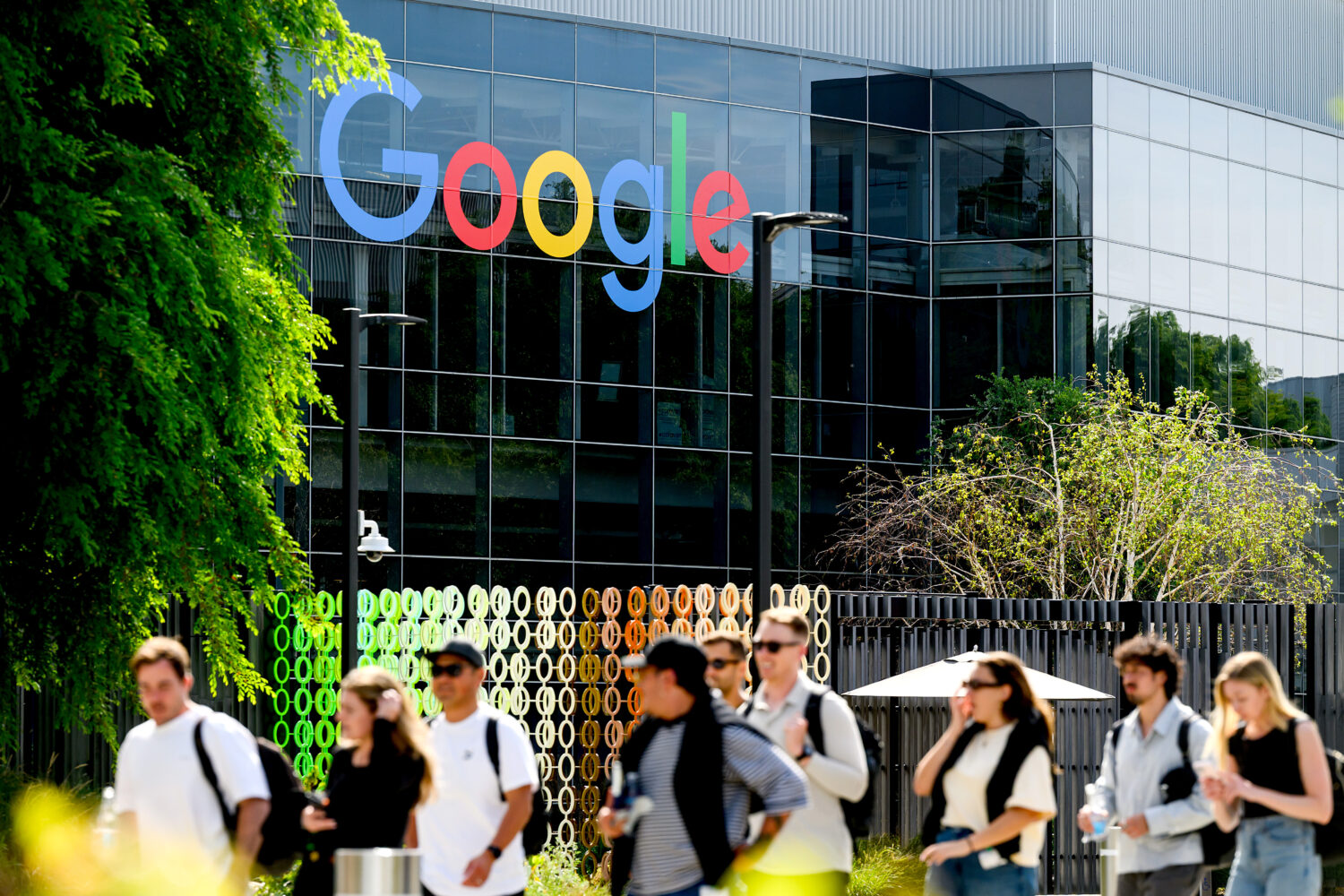 People walk through Google headquarters in Mountain View, Calif., on Thursday, March 26, 2026. (AP ...