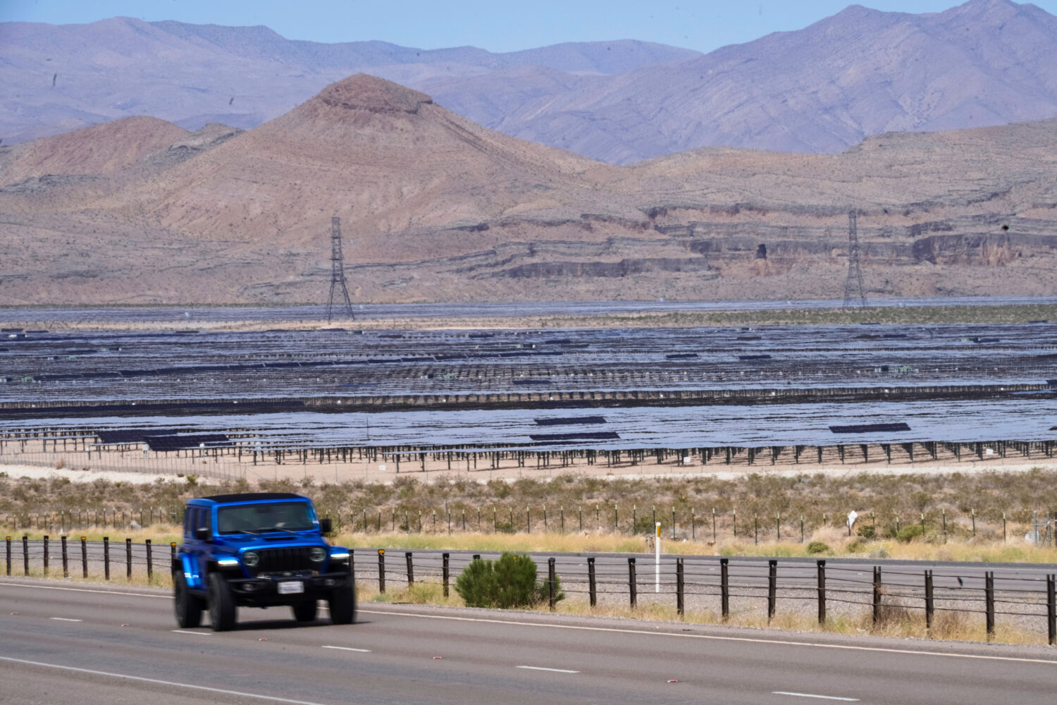 Solar panels stretch out across the desert floor, Thursday, April 2, 2026, in North Las Vegas. (AP ...
