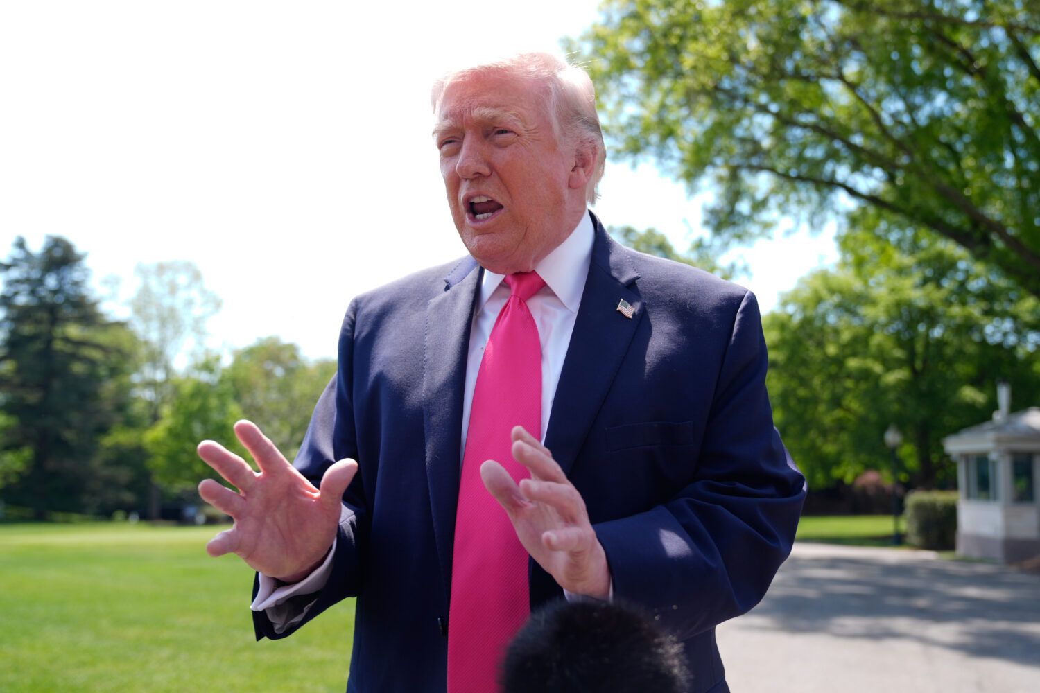 President Donald Trump speaks with reporters before departing on Marine One from the South Lawn of ...