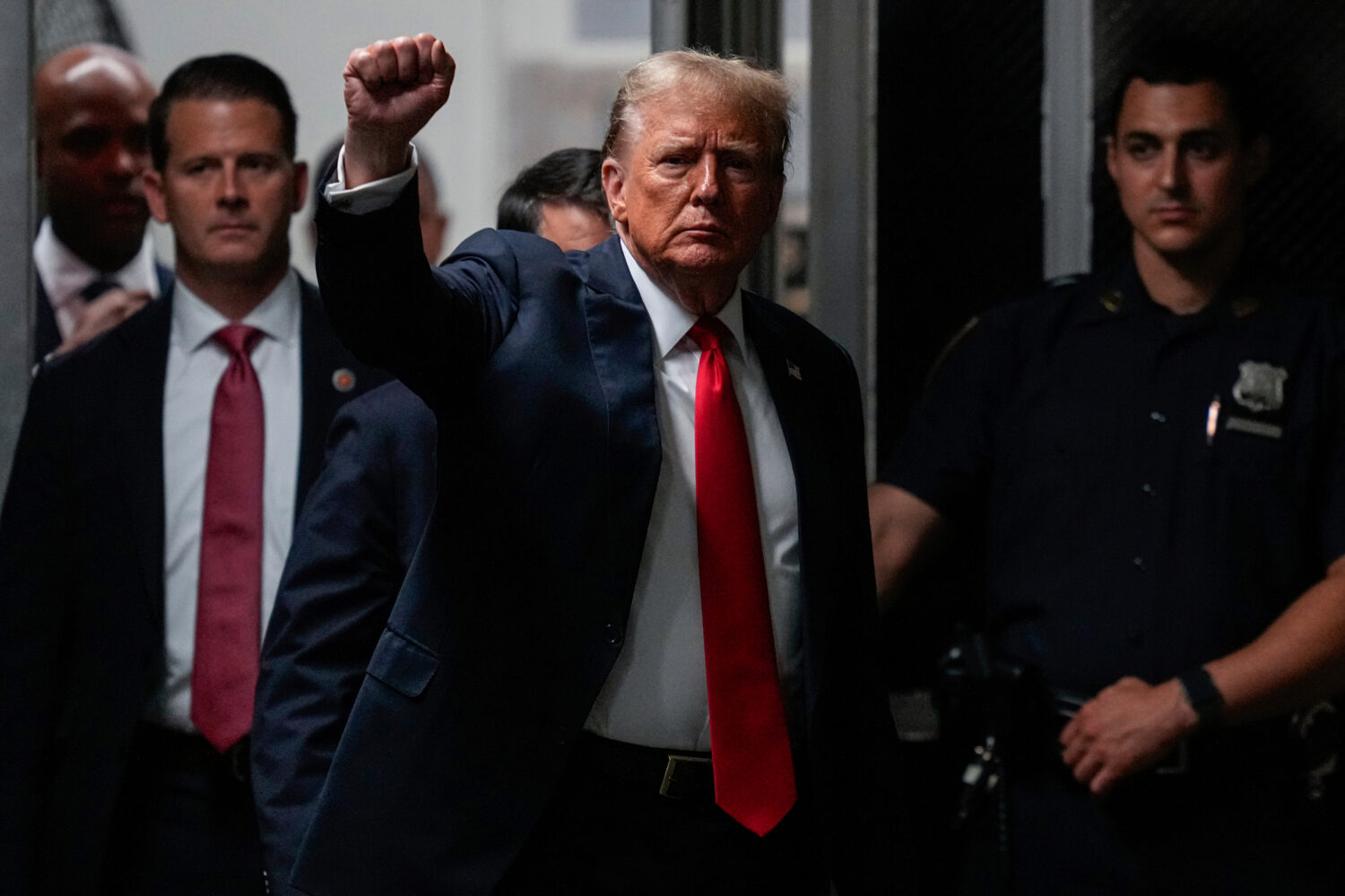 FILE - Former President Donald Trump returns from a lunch break at Manhattan Criminal Court, May 28...