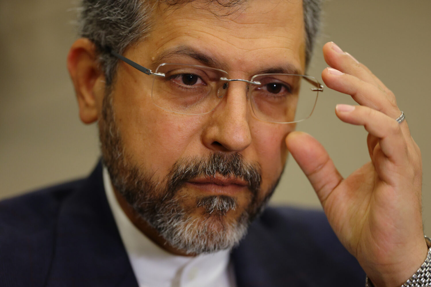 Iran's Deputy Foreign Minister Saeed Khatibzadeh adjusts his glasses as he talks during an intervie...