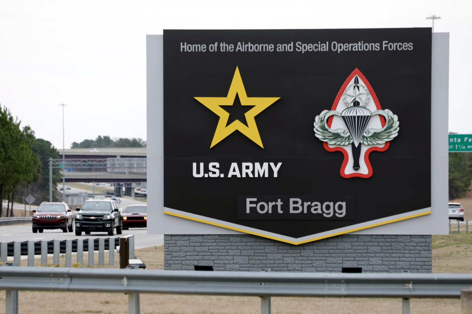 FILE - A sign for Fort Bragg is seen, March 7, 2025, in Fort Bragg, N.C. (AP Photo/Chris Seward, Fi...