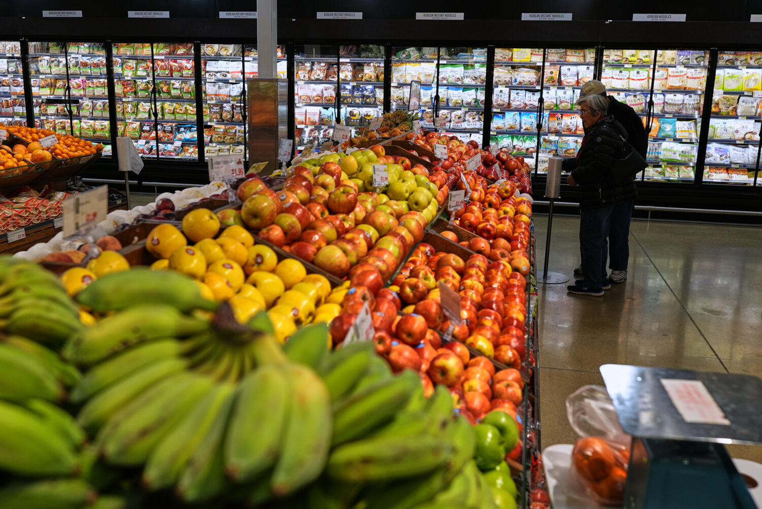 People shop at a grocery store, in Schaumburg, Ill., Thursday, April 2, 2026. (AP Photo/Nam Y. Huh)...