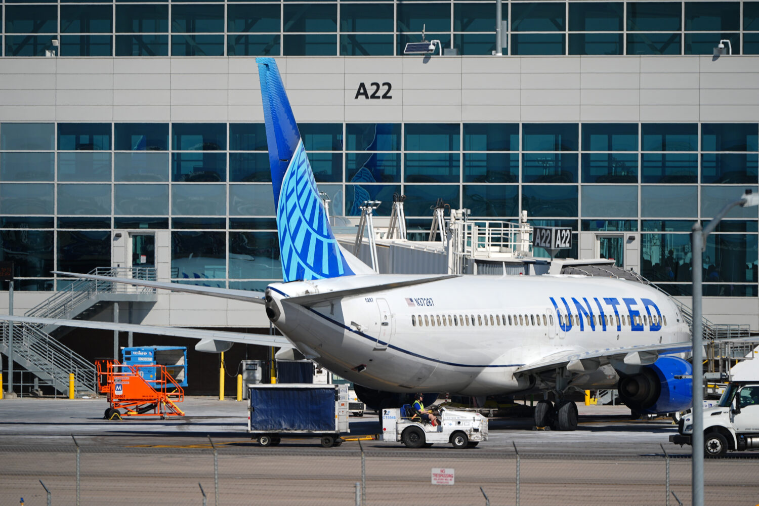 FILE - A United Airlines jetliner sits at a gate along the A concourse of Denver International Airp...