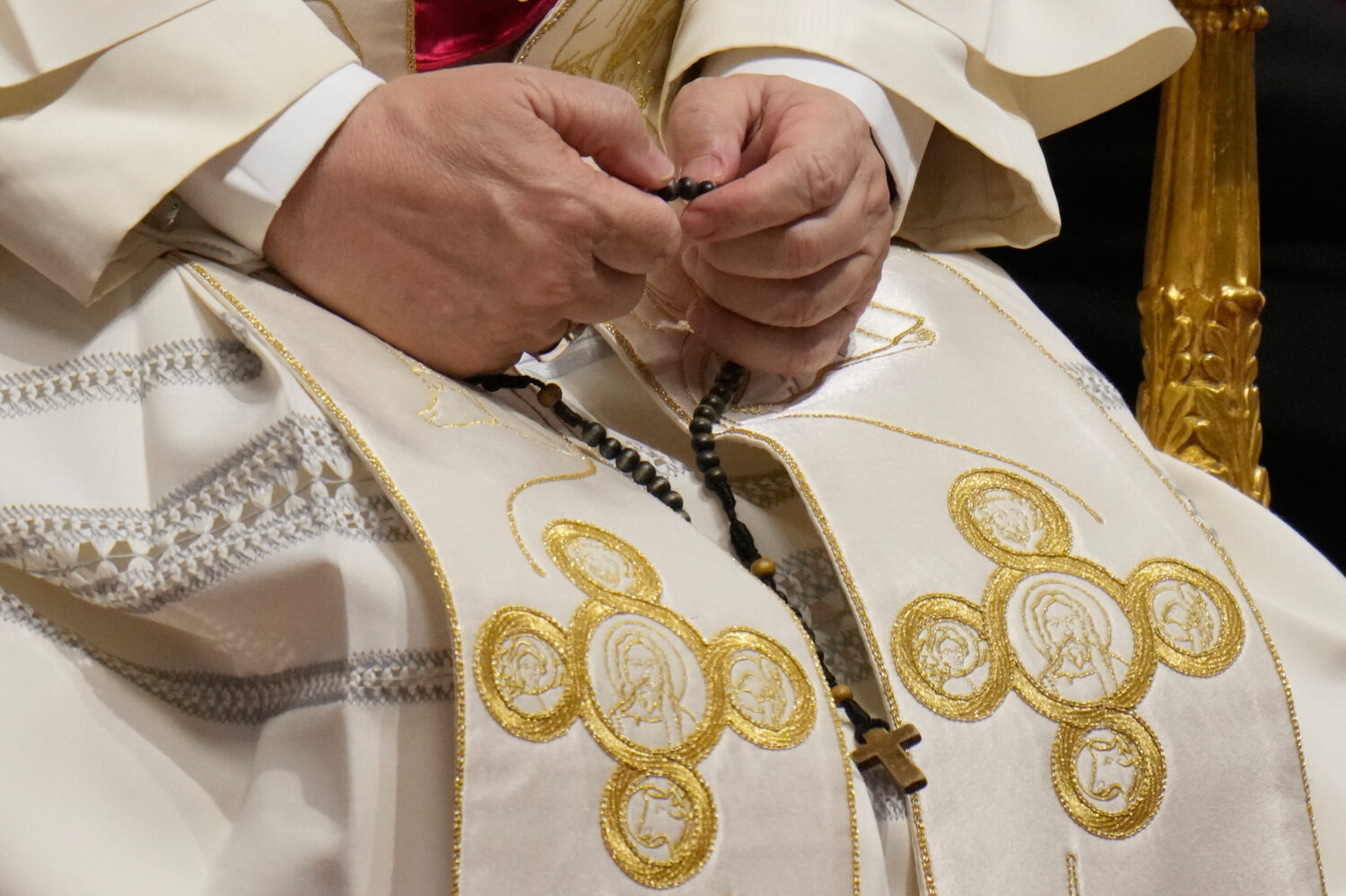 Pope Leo XIV holds a rosary as he leads a vigil for peace inside St. Peter's Basilica at the Vatica...