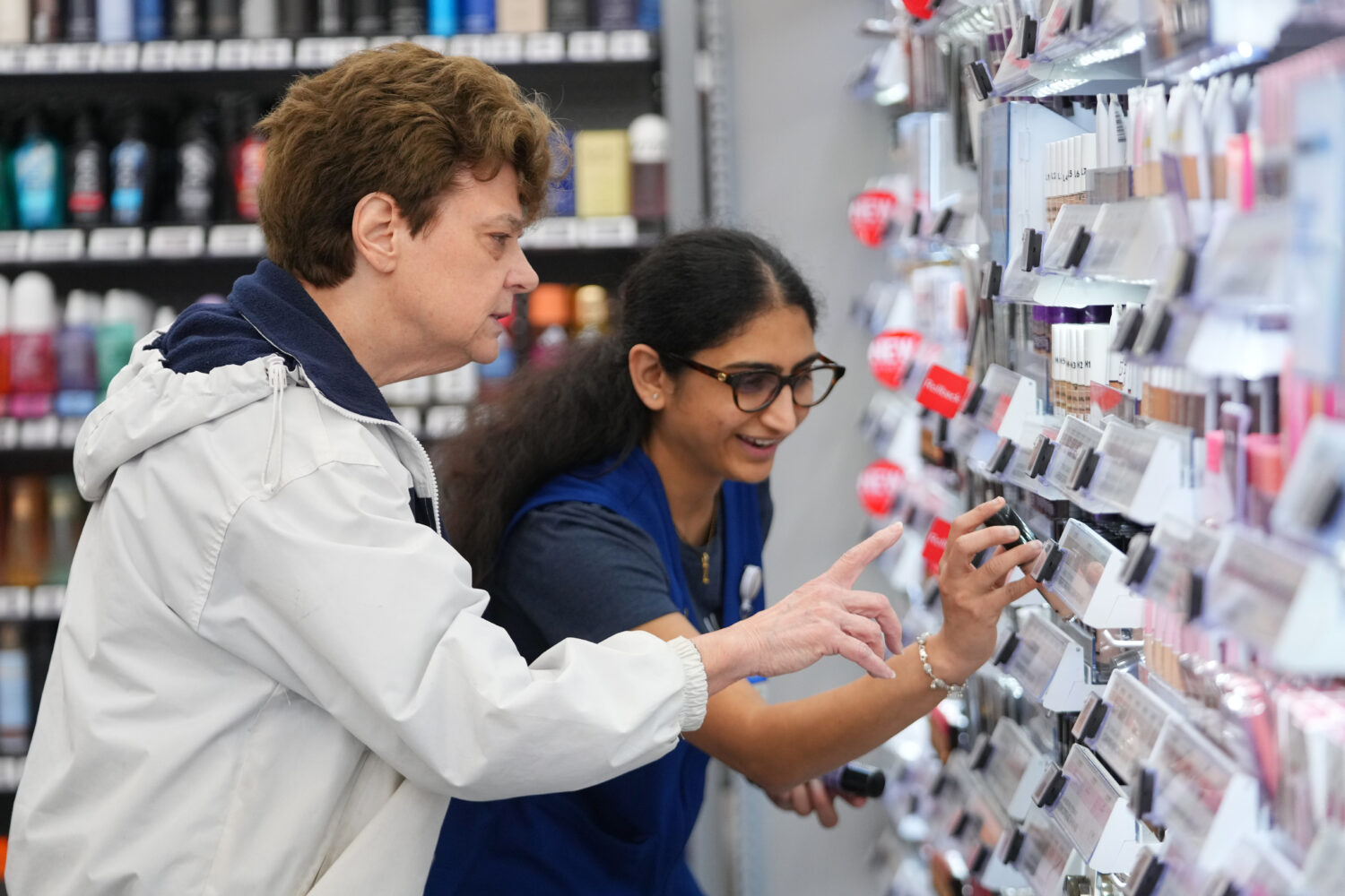 Priyanka Patil, right, fashion team lead at Walmart, helps Linda Flippin, of Colleyville, Texas, fi...