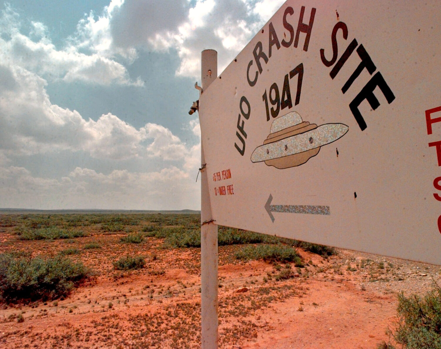 FILE - A sign directs travelers to the "1947 UFO Crash Site Tours" in Roswell, N.M., on June 10, 19...