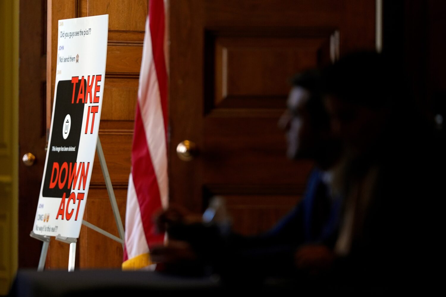FILE - A poster outside a roundtable about an online safety bill, hosted by first lady Melania Trum...