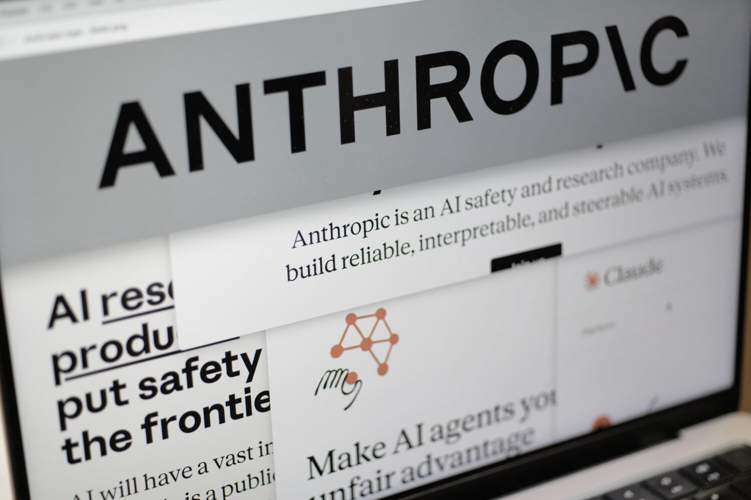FILE - Pages from the Anthropic website and the company's logo are displayed on a computer screen i...