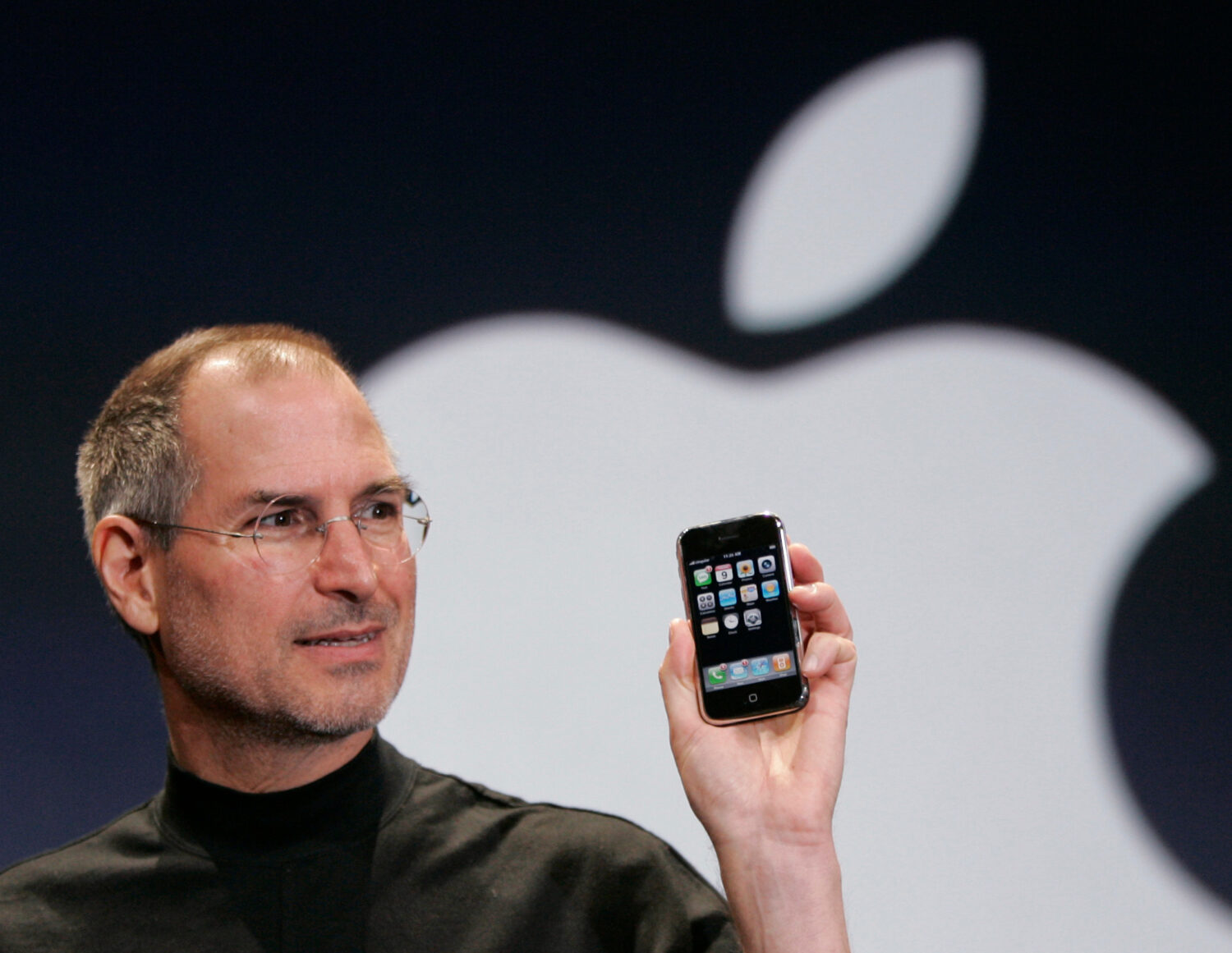 FILE - Apple CEO Steve Jobs holds up an Apple iPhone at the MacWorld Conference in San Francisco on...
