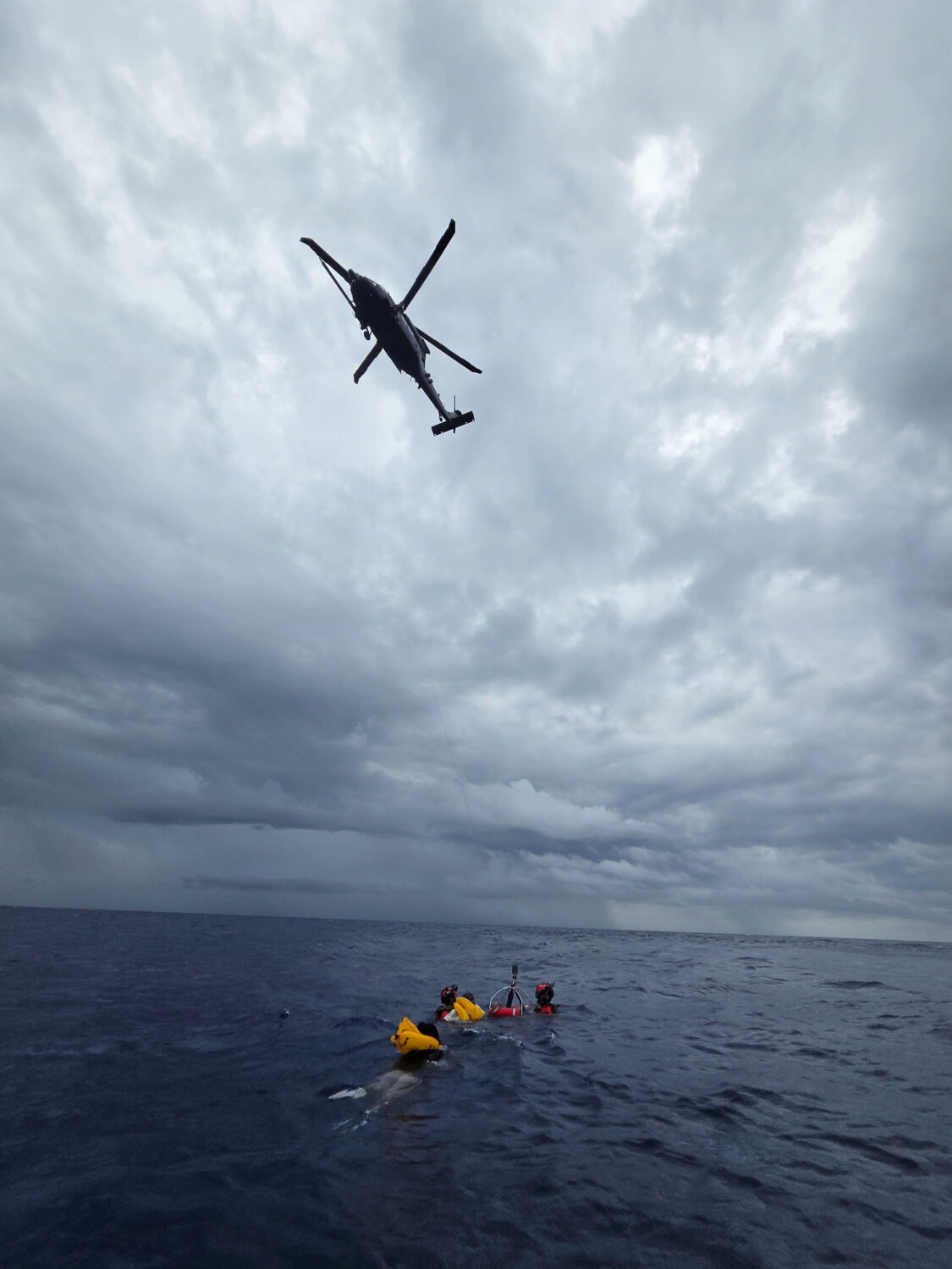 This photo provided by the U.S. Air Force shows rescue operations underway for survivors of a downe...