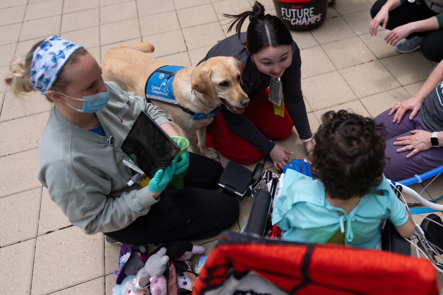 Cincinnati Children's Hospital facility dog Hadley and hospital staff including registered nurse Ha...